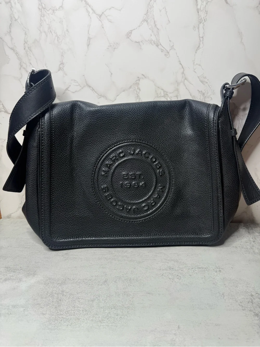 Marc Jacobs Black Pebbled Leather Messenger Bag with Embossed Round Logo